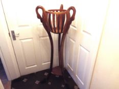 A tall basket top plant stand with three carved swan head terminals, on long feet, 129 cm (high),