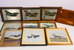A collection of framed photographic images of military aircraft bearing annotations and four framed