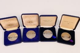 Four vintage Lombard RAC Rally finisher's medals, two for 1985, one 1987 and one 1989,