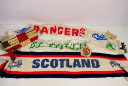 A collection of football related items to include vintage wooden rattle,