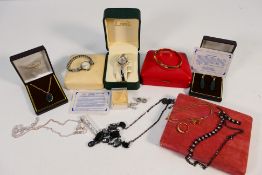 A quantity of costume jewellery and wristwatches including a pair of rose metal Celtic knot design