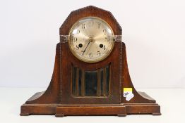 An oak cased mantel clock.