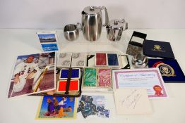 A mixed lot comprising playing cards, signed photograph of Alan Bean,