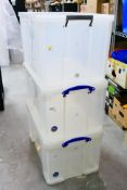 Three lidded storage boxes comprising two Really Useful 84 litre examples and one similar 85 litre.