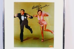 A framed and signed colour image from Singing In The Rain which bears the marker pen signature of