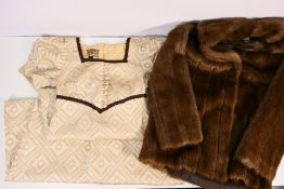 A faux fur jacket, size 12 and a vintage Marion Donaldson dress, size 12.
