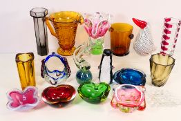 A collection of decorative art glass comprising animal figures including Mdina, vases,