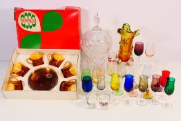 A collection of glassware to include vase, glasses and similar.