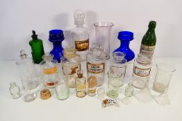 A collection of apothecary and similar jars and items to include Poison jar and other.