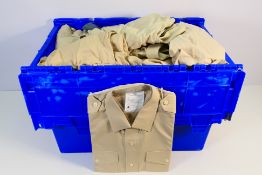 A large quantity of ex MOD FAD shirts and similar, mostly in fawn, long and short sleave,