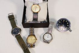 A collection of vintage watches and a Be