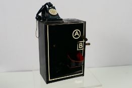 A vintage tinplate money bank in the for