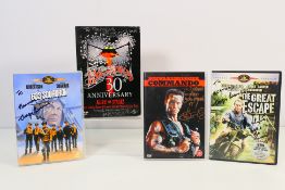 A collection of DVDs bearing signatures