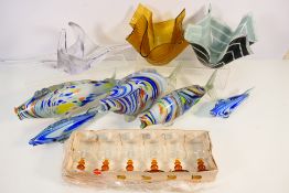 A collection of Murano style glass fish,