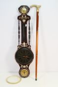 A tippling walking stick with decorative brass handle,