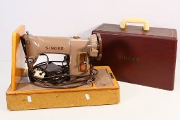 A vintage Singer sewing machine in carry