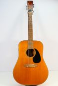 An Angelica acoustic guitar contained in