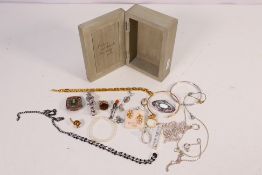 A collection of costume jewellery to include a small silver bangle, Chester assay 1937,