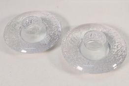 A pair of Orrefors Discus Votive tea lig