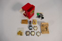 A collection of wristwatches and watch parts.