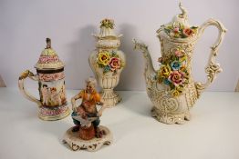 Capodimonte to include a large ewer and cover, a similar vase, stein and figure,