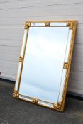 A gilt framed, bevel edge wall mirror, approximately 69 cm x 96 cm.