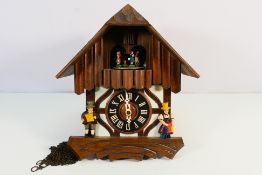 A vintage cuckoo clock, lacking weights