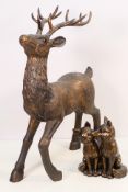 A bronzed figure depicting a stag, approximately 51 cm (h) and a similar group of two foxes.