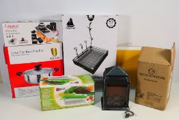 Lot to include a Fireplace Lamp, Fullstar Mandoline & Spiral Slicer, Lyve Cooking Pot,