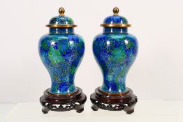 A pair of Chinese cloisonne vases and covers decorated with chrysanthemum in tones of blue and