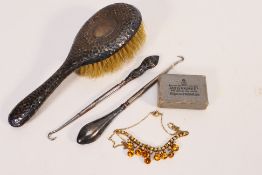 Lot to include a silver mounted dressing table brush and two silver handled button hooks,