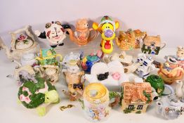 A collection of novelty teapots to include Wade, Border Fine Arts and similar. [2].