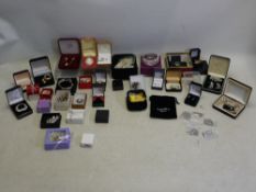 A collection of costume jewellery, predominantly boxed to include brooches, earrings,