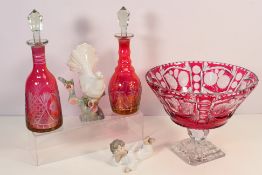 A cranberry glass cut to clear pedestal