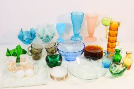 A collection of decorative glassware to include vases, jugs and similar.