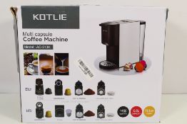 A boxed Kotlie Multi Capsule Coffee Machine, model AC-513K.