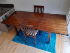 A Laura Ashley mahogany, extending dining table and two chairs,