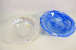 Two glass bowls, one with a blue swirl decoration and the other opalescent,