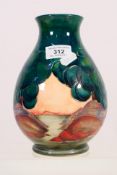 Moorcroft - A Moorcroft Pottery baluster form vase decorated in the Mamoura pattern,