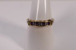 A 9ct yellow gold ring set with amethyst and diamond chips, size P, approximately 2.5 grams.