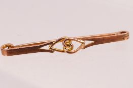 A 9ct rose gold bar brooch with entwined hearts motif, Chester assay 1916, 4.