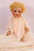 An antique Heubach Koppelsdorf 342 - 6 bisque head doll with blonde curls,
