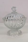 A clear glass Baccarat pedestal dish with cover with swirl decoration, approximately 16 cm (h).