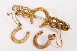 A 9ct yellow gold bar brooch with horseshoe motif and a similar pair of 9ct gold earrings,