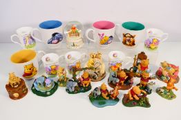 Disney - Lot to include a quantity of Winnie The Pooh related mugs and various figures / groups to