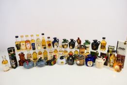 A collection of whisky miniatures to include Jura Origin, Bruichlsaddich, Oban, Dimple, Cardhu,