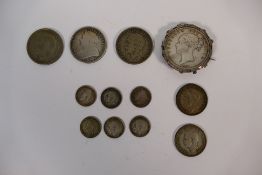 A small collection of silver content coins, Victorian and later to include an 1887 half crown,