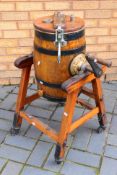 An antique Waide & Sons Ltd coopered oak butter churn on stand, maker's plate to the top,
