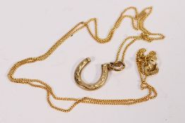 A 9ct yellow gold fine trace necklace and horseshoe pendant, 46 cm (l), approximately 1.5 grams.