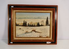 A framed oil on canvas landscape scene, signed by the artist lower right,